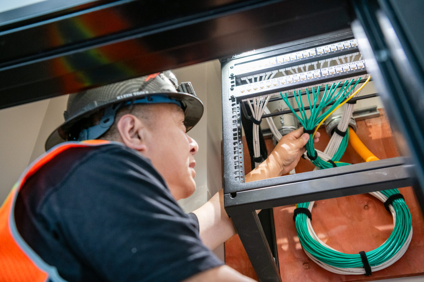 A man working on an electrical panel.